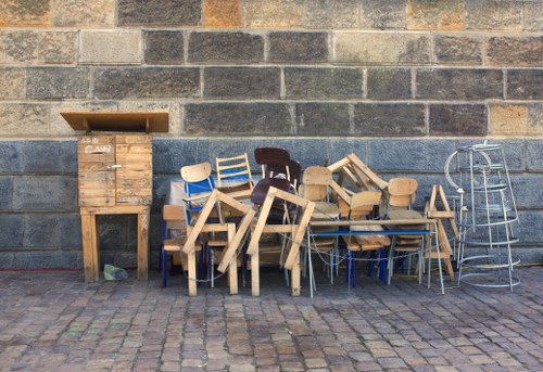 Professionals removing old furniture from a Highgate home